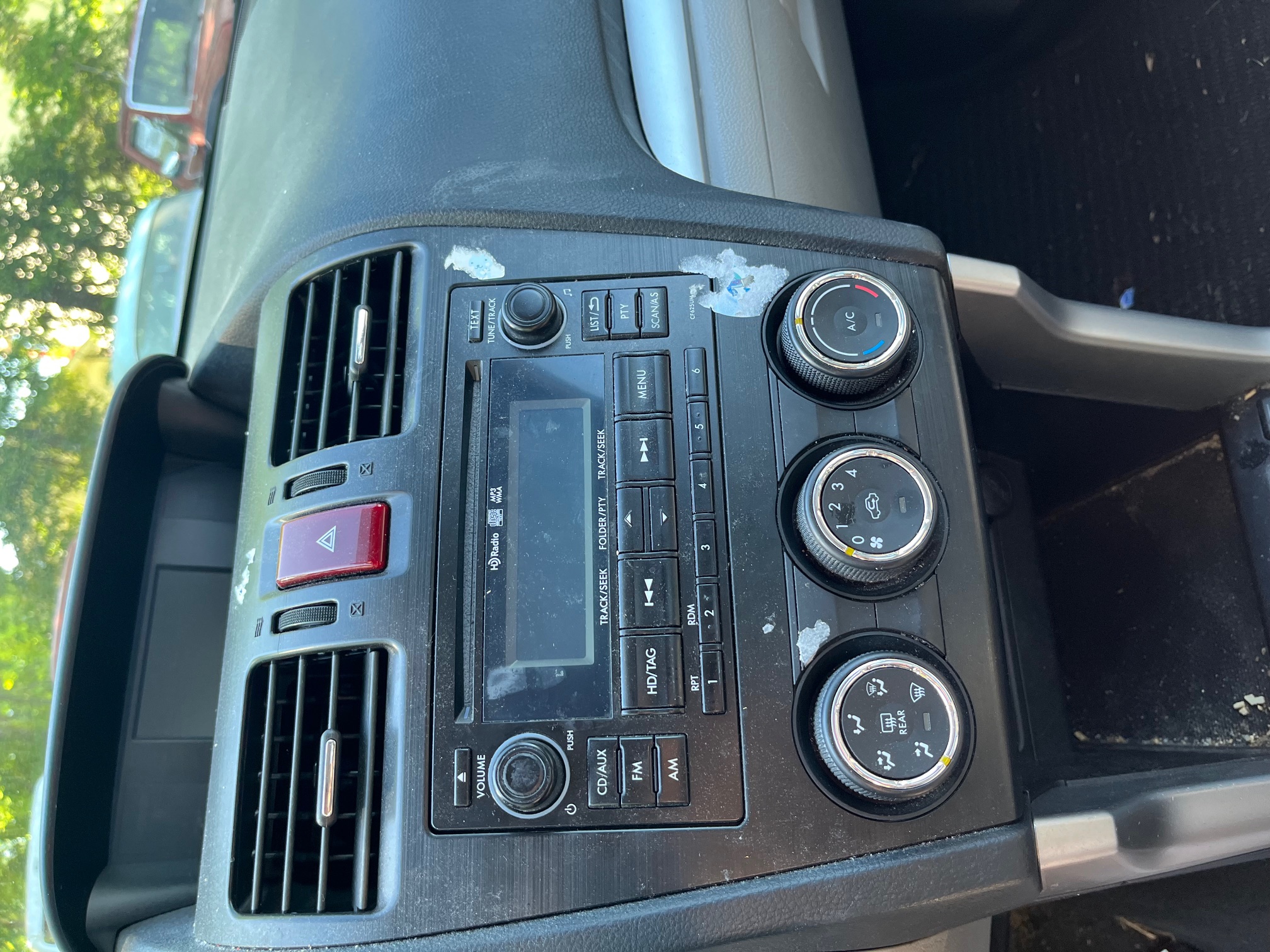 Dashboard stereo controls before cleaning